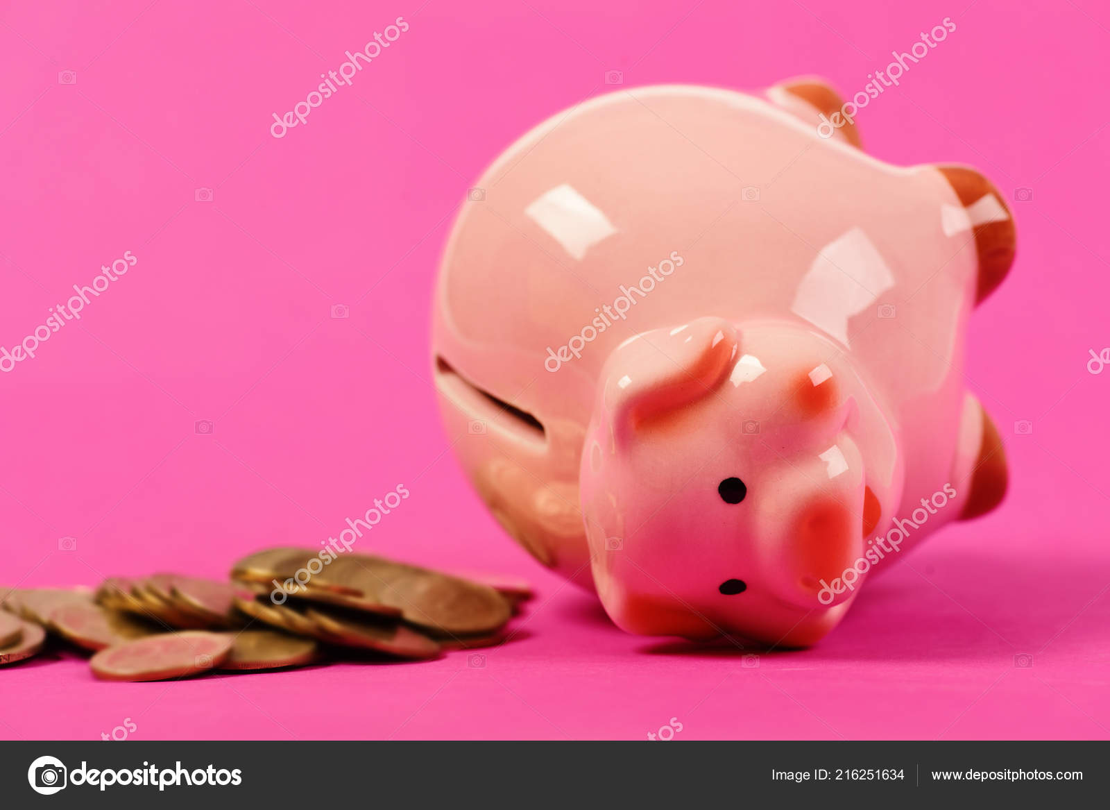 Ceramic Toy Pig On Back With Money Fallen Out Stock Photo - 