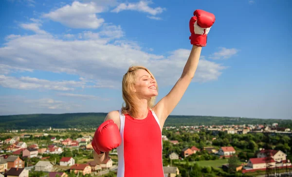 Girls power concept. Girl boxing gloves symbol struggle for female rights and liberties. Fight for female rights. Woman strong boxing gloves raise hands blue sky background. Feminism promotion — Stock Photo, Image