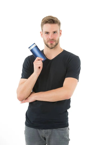 Man bearded stylish hold plastic shampoo bottle. Guy handsome use popular cosmetic or hygienic shampoo product. Man show his favorite shampoo conditioner for hair. Guy satisfied with this shampoo — Stock Photo, Image