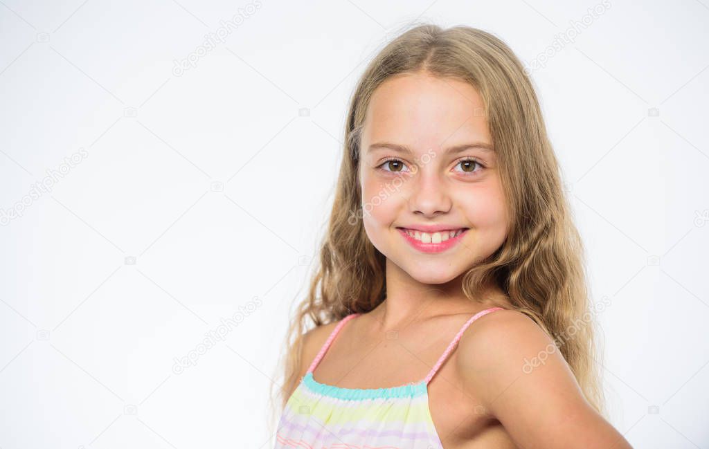 How to care for childs hair. Girl long hair smiling face white background. Natural beauty. Teaching your child healthy hair care habits. Hair care tips for kids. Kid little girl happy look at camera