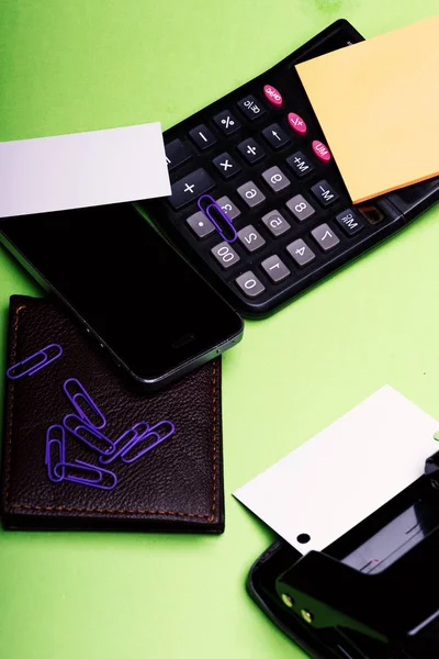 Business accessories and gadgets concept. Stationery, wallet, phone and calculator — Stock Photo, Image