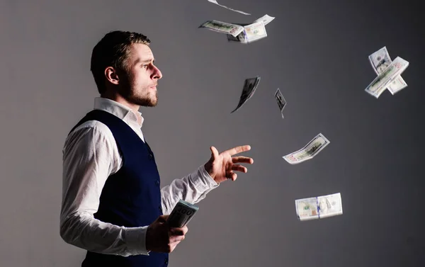 Richness and wealth concept. entrepreneur on arrogant face wasting money. — Stock Photo, Image