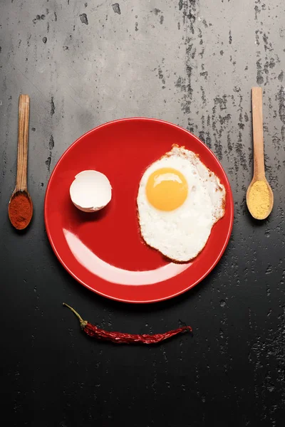 Breakfast and food art concept. Omelet and eggshell