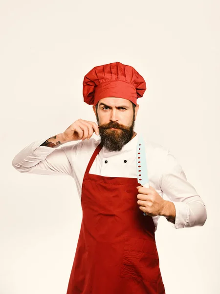 Chef kok tegen witte achtergrond raken snor — Stockfoto