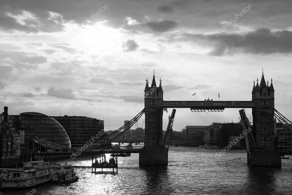Tower bridge with skyline London, United Kingdom. Bridge over Thames river on cloudy sky. City buildings on river banks. Architecture and structure concept. Wanderlust and vacation