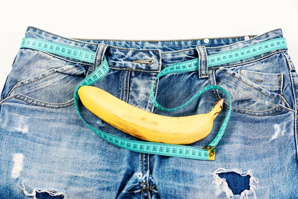 Fruta de banana kinky em virilha de calça, close . — Fotografia de Stock