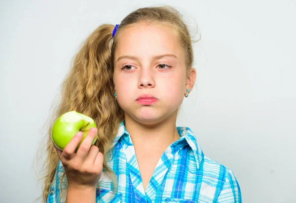 Vitamin nutrition concept. Reasons eat apple every day. Nutritional content of apple. Apple a day keeps doctor away. Good nutrition is essential to good health. Kid girl eat green apple fruit