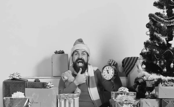 Santa holds old clock showing thumbs up. — Stock Photo, Image