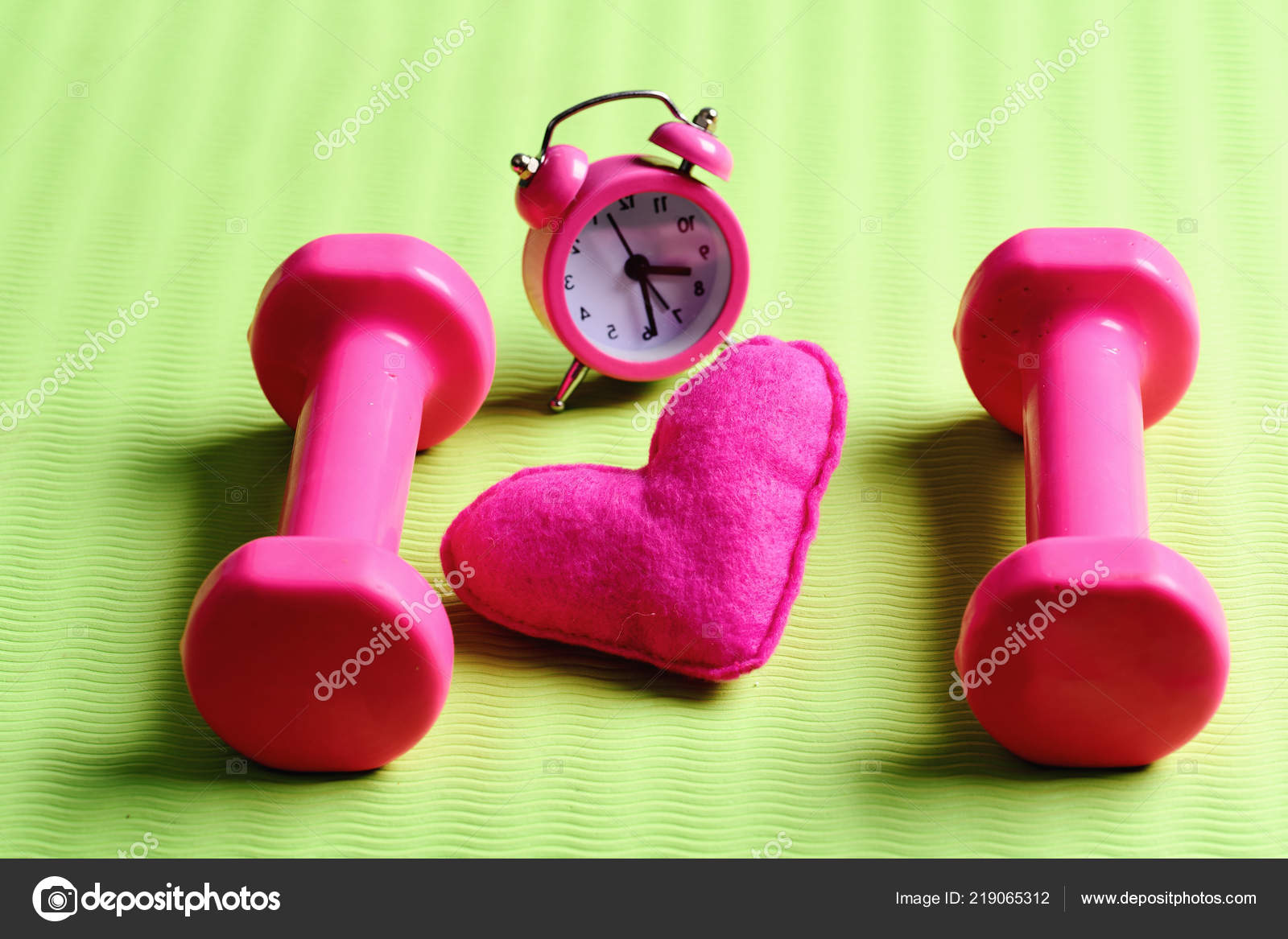 Morning Workout Concept Dumbbells In Pink Color Near Alarm