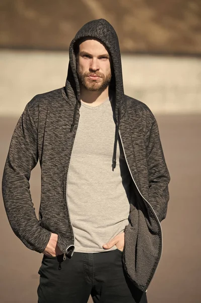man sport fashion, bearded guy model in black hoodie