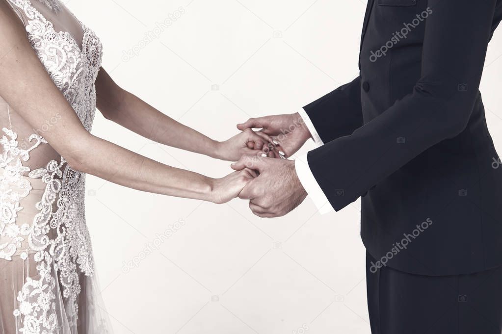 ballrom dance couple in love, holding hands isolated on white bachground