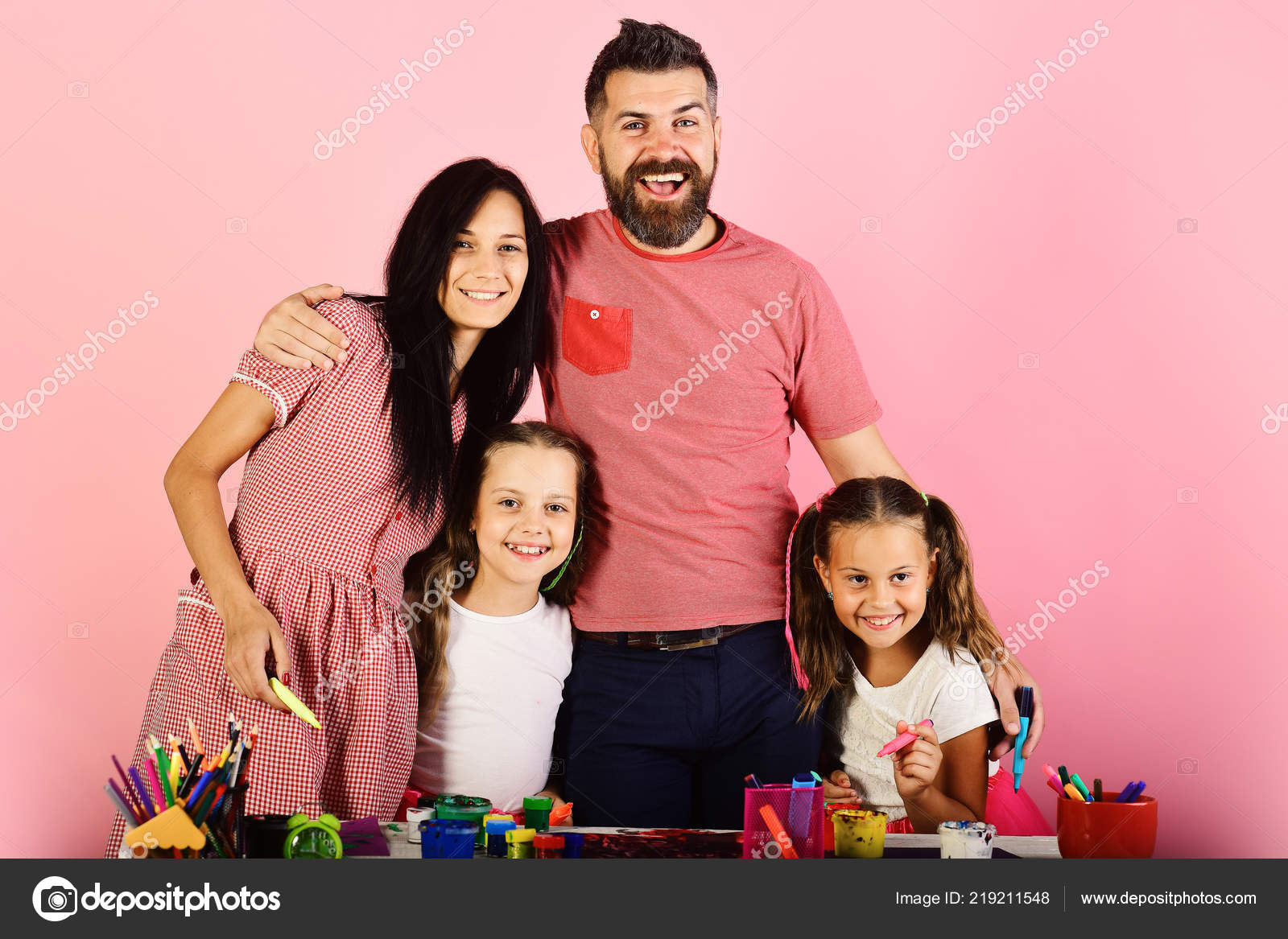 Girls Man And Woman With Happy Faces By Art Desk Stock Photo