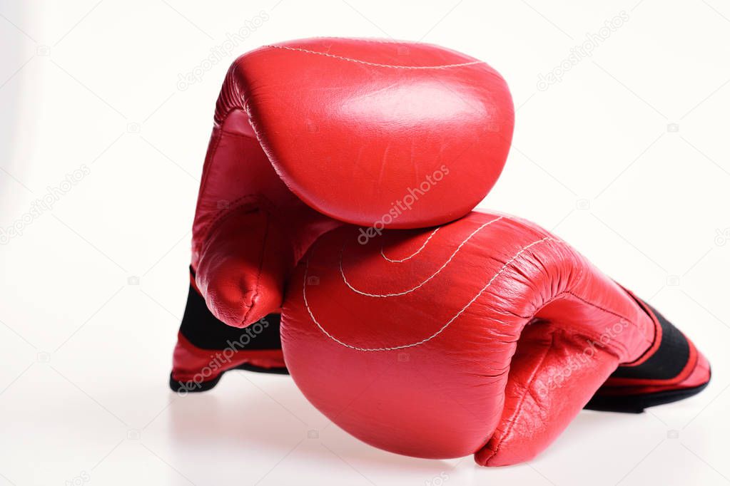 Boxing gloves in red color isolated on white background