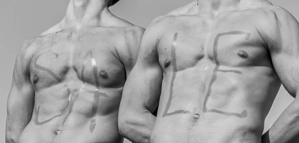 Chests of sexy muscular athletes, nude torsosand sky on background. Inscription sale on sexy muscular chests. Sale concept. Muscular torsos of strong sportsmen with word sale written on — Stock Photo, Image