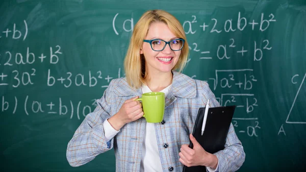 Keep positive attitude to work. Woman with tea cup and document folder chalkboard background. Time to relax. Teacher drink tea or coffee and stay positive. Find time to relax and stay positive — Stock Photo, Image