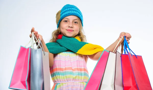 Shopping on black friday. Girl cute face wear knitted autumn hat and scarf hold shopping bags white background. Shopping concept. Fall season sales. Sale and discount. Shopping fall winter season — Stock Photo, Image