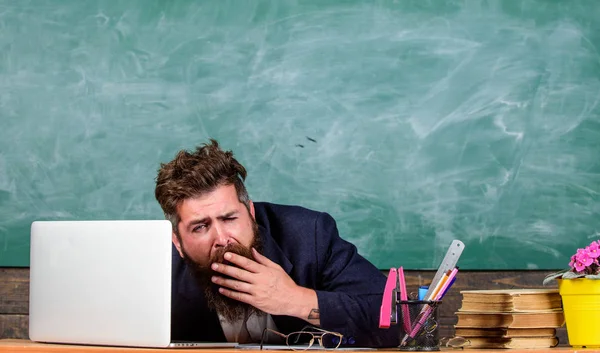 Educators more stressed at work than average people. Life of teacher full of stress. Educator bearded man yawning face tired at work. High level fatigue. Exhausting work in school causes fatigue
