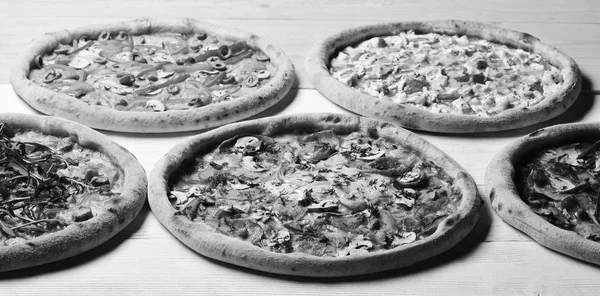 Italian pizza and pizzeria. Take away food with various ingredients — Stock Image Italian pizza and pizzeria. Take away food with various ingredients Royalty Free Stock Photos