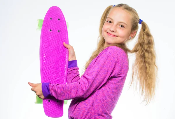 Plastic skateboards for everyday skater. Child hold penny board. Penny board of her dream. Best gifts for kids. Ultimate gift list help pick perfect present for girl. Kid long hair carry penny board — Stock Photo, Image