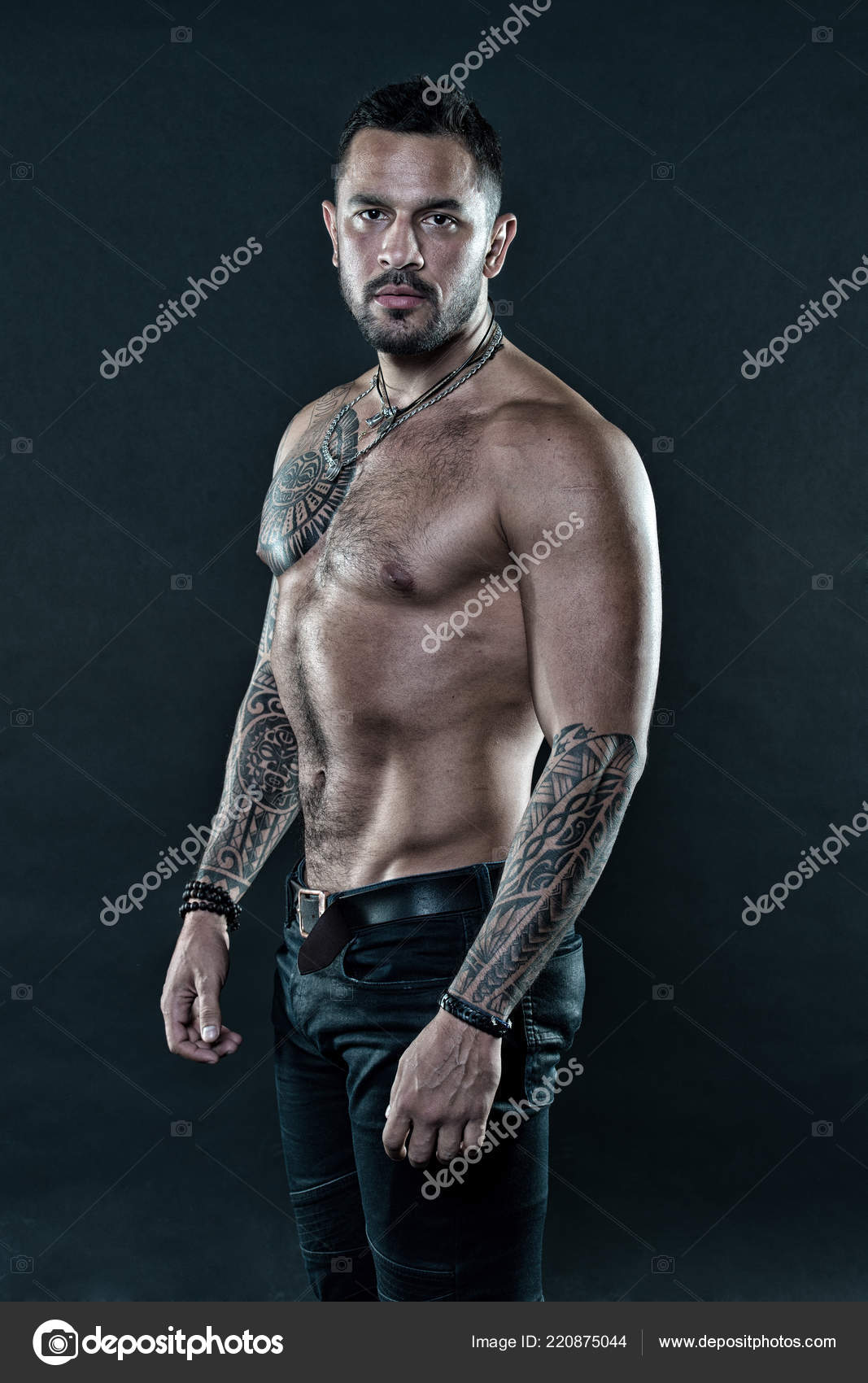 Get tattoo here. Man with muscular torso. Muscular man with sexy tattoo  style. Macho style. Sexy is about confidence Stock Photo by ©stetsik  220875044