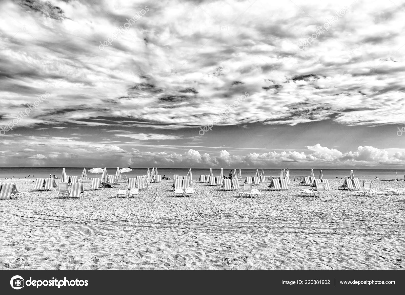 Beach Chairs And Umbrellas On Cloudy Sky In Miami Usa Sea