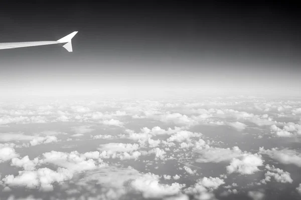 Sky and clouds seen from plane window. Atmosphere, stratosphere, air. Cloudscape, weather, nature. Wanderlust, adventure, discovery. Vacation, travel, trip — Stock Photo, Image