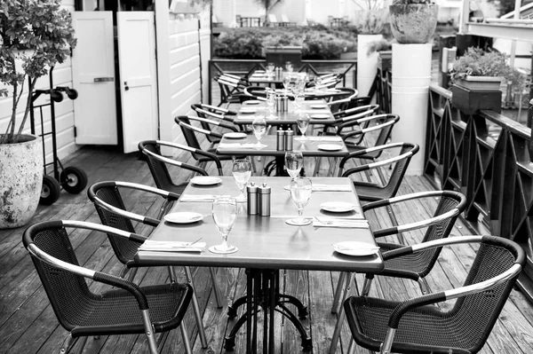 Terrace with tables, chairs and cutlery in philipsburg, sint maarten. Restaurant open air. Eating and dining outdoor. Summer vacation at Caribbean island, travelling. Enjoy life concept