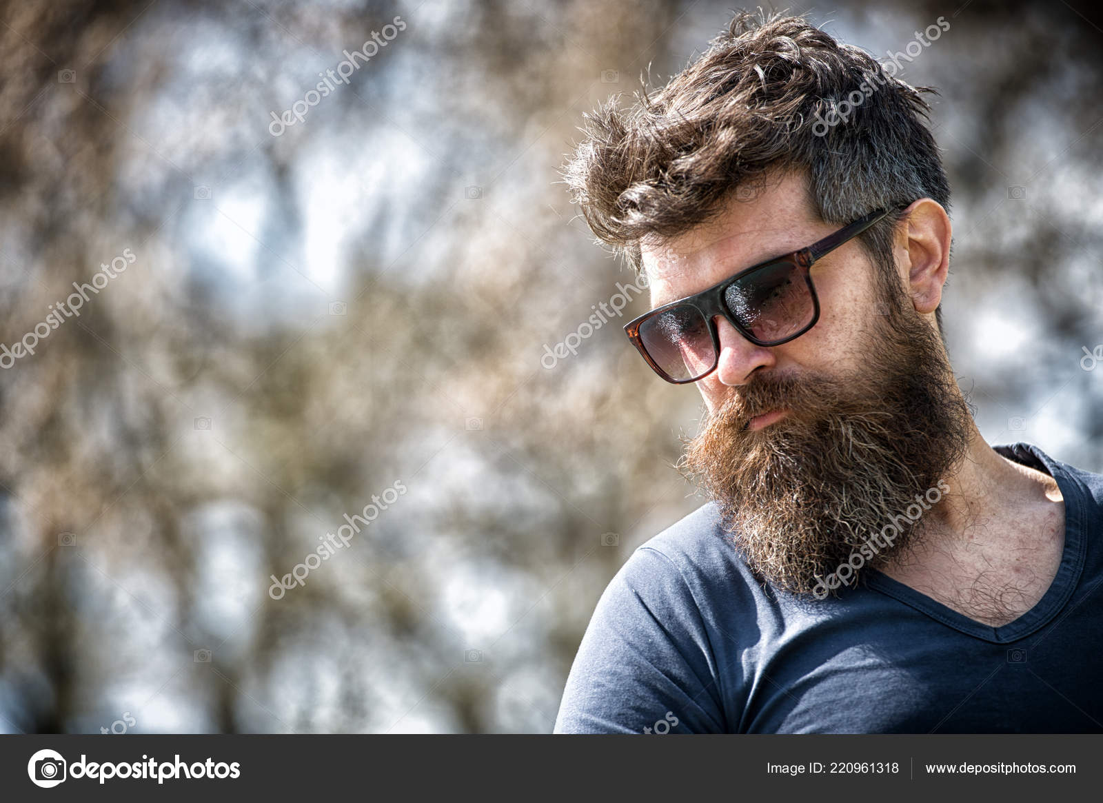 Macho with beard and mustache look confident brutal in sunglasses