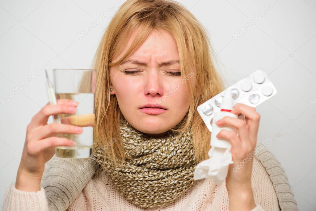 Getting fast relief. Ways to feel better fast. Headache and flu remedies. Get rid of flu. Woman wear warm scarf because illness or flu. Girl hold glass water tablets and thermometer nasal drops