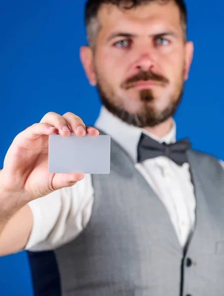Plastic bank card copy space. Easy money credit. Man bearded hipster hold blank card blue background. Take this card. Make shopping easy. Which bank credit card easy get. Banking and credit concept