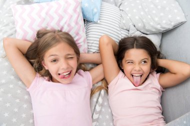 Slumber party timeless childhood tradition. Girls relaxing on bed. Slumber party concept. Girls just want to have fun. Invite friend for sleepover. Best friends forever. Consider theme slumber party clipart