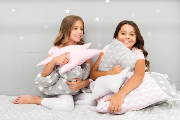 Girls kids hug cute pillow. Cute kids pillows they will love to cuddle. Find decorative pillows and add fun to room. Happy childhood cozy home. Adorable cushions for your child room — Stock Photo, Image