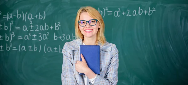 Woman teacher with book in front of chalkboard think about work. Cognition process in learning. Cognition process of acquiring knowledge through thoughts. Teach cognition processing strategies — Stock Photo, Image
