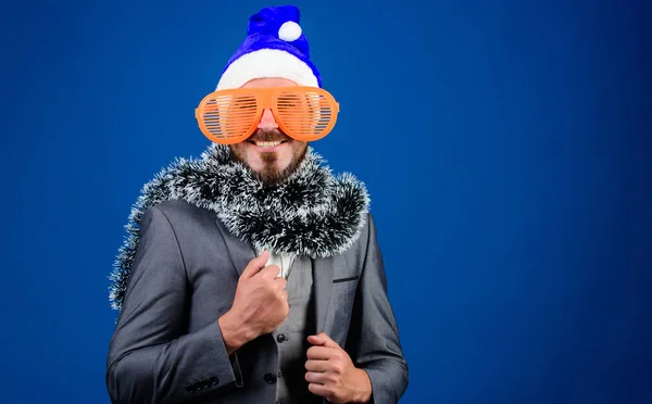 Corporate christmas party. Man bearded hipster wear santa hat and funny sunglasses. Manager tinsel ready celebrate new year. Christmas party office. Corporate holiday party ideas employees will love