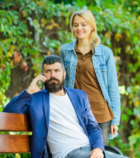 Couple in love romantic date walk nature park background. Great date tips. Love relations romantic feelings. Romantic concept. Man bearded hipster wait girlfriend. Park best place for romantic walk