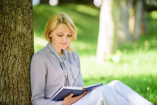 Books every girl should read. Girl concentrated sit park read book nature background. Reading inspiring books. Female literature. Relax leisure an hobby concept. Best self help books for women