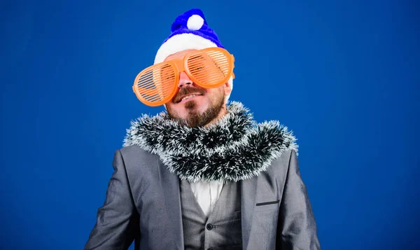 Corporate christmas party. Man bearded hipster wear santa hat and funny sunglasses. Christmas party organisers. Guy tinsel ready celebrate new year. Corporate party ideas employees will love