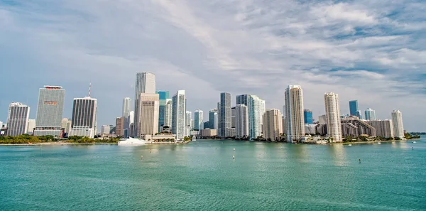 Miami skyscrapers with blue cloudy sky, boat sail, Aerial view — Stock Photo, Image