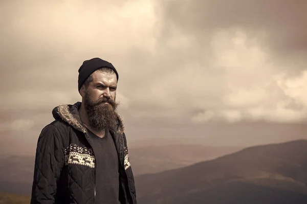Bearded handsome serious man on mountain top — Stock Photo, Image