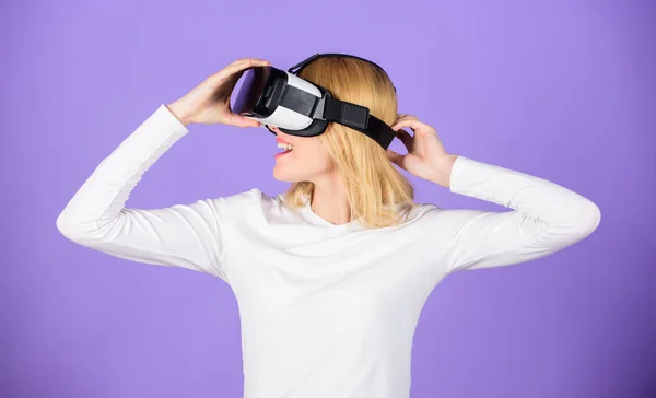 Virtual reality and future technologies. Girl use modern technology vr headset. Explore virtual reality. Digital device and modern opportunities. Woman hold vr headset glasses violet background