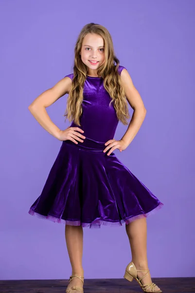 Ballroom fashion. Girl child wear velvet violet dress. Clothes for ballroom dance. Kid fashionable dress looks adorable. Ballroom dancewear fashion concept. Kid dancer satisfied with concert outfit