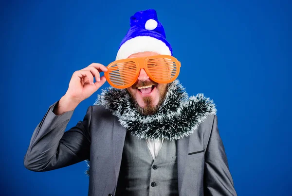 Christmas party office. Corporate holiday party ideas employees will love. Corporate christmas party. Man bearded hipster wear santa hat and funny sunglasses. Manager tinsel ready celebrate new year
