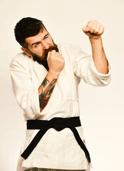 Judo master med svart bälte biter naglar i rädsla — Stockfoto