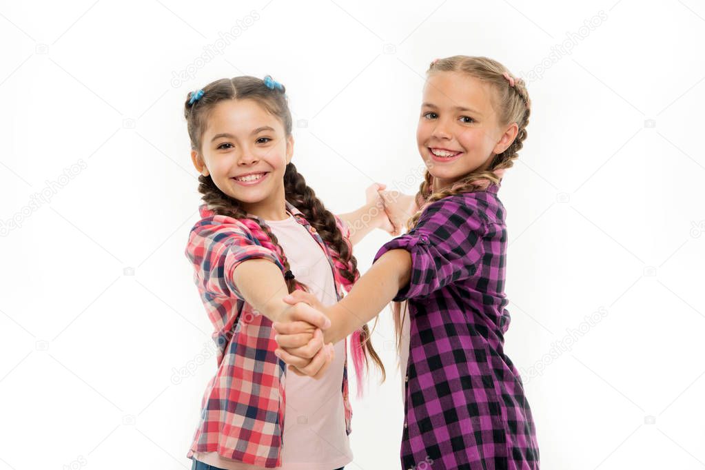 Dress similar with best friend. Dress to match your friend. Best friend dressing. Girls friends wear similar outfits have same hairstyle kanekalon braids white background. Sisters family look outfit