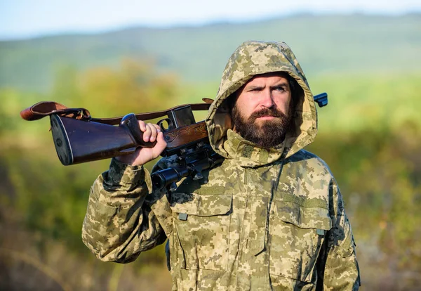 Guy hunting nature environment. Bearded hunter rifle nature background. Harvest animals typically restricted. Hunting hobby concept. Experience and practice lends success hunting. Hunting season
