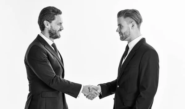 Men in suits or businessmen hold hands in handshake. — Stock Photo, Image