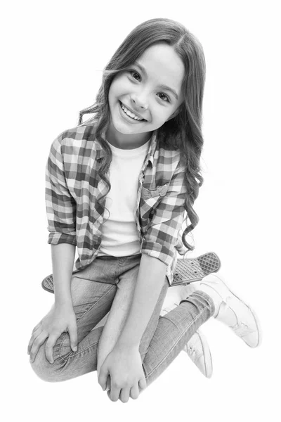 Happy ride. Kid girl happy sits penny board. Originally designed as girls skateboard. Modern teen hobby. Girl happy face sit on penny board white background. Learning how to ride penny board — Stock Photo, Image