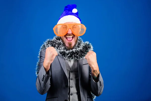 Man bearded hipster wear santa hat and funny sunglasses. Manager tinsel ready celebrate new year. Corporate holiday party ideas employees will love. Christmas party office. Corporate christmas party — Stock Photo, Image