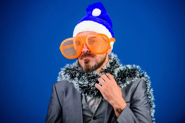 Christmas party organisers. Guy tinsel ready celebrate new year. Corporate party ideas employees will love. Corporate christmas party. Man bearded cheerful hipster wear santa hat and funny sunglasses