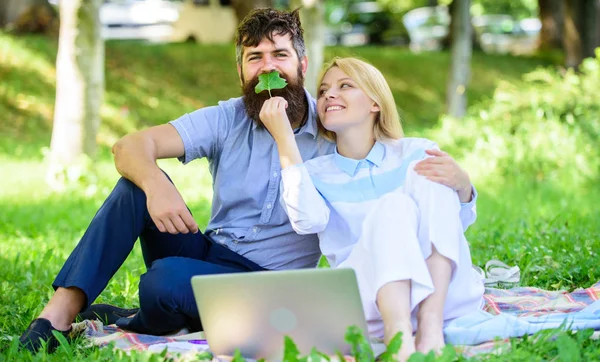 Modern online business. How to balance freelance and family life. Family spend leisure outdoors work laptop. Stories of enduring family success and innovation. Couple in love or family work freelance